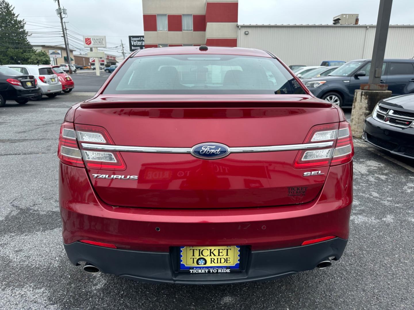 2013 RED Ford Taurus SEL FWD (1FAHP2E8XDG) with an 3.5L V6 DOHC 24V engine, 6-Speed Automatic transmission, located at 1254 Manheim Pike, Lancaster, PA, 17601, (717) 393-9133, 40.062870, -76.323273 - Photo#5